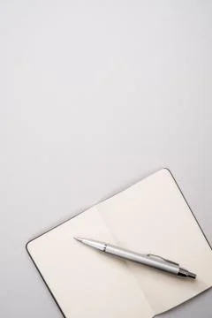 Open notebook with pen Stock Photos
