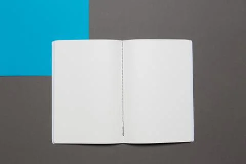 Open notebook with pencil on a gray background. Office notepad flat lay Stock Photos