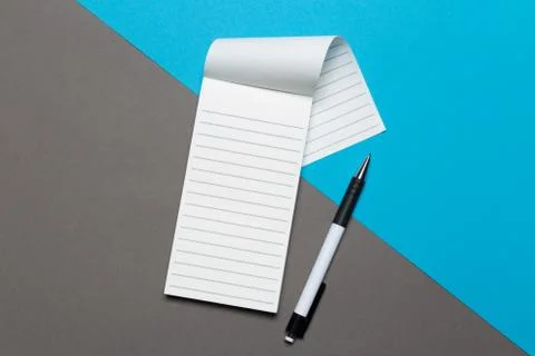 Open notebook with pencil on a gray background. Office notepad flat lay. Top  Stock Photos