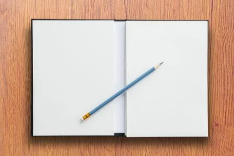 Open notebook with pencil Stock Photos