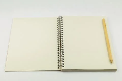 Open notebook with pencil on white background Foto stock