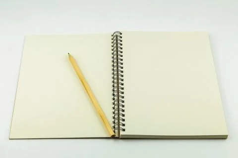 Open notebook with pencil on white background Foto stock