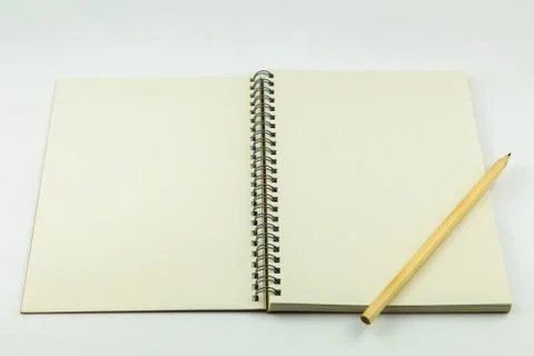 Open notebook with pencil on white background Foto stock