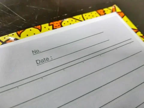 An open notebook with a section for writing the note number and date Stock Photos
