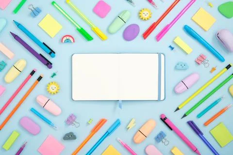 Open notebook with space for your text with colorful supplies Stock Photos