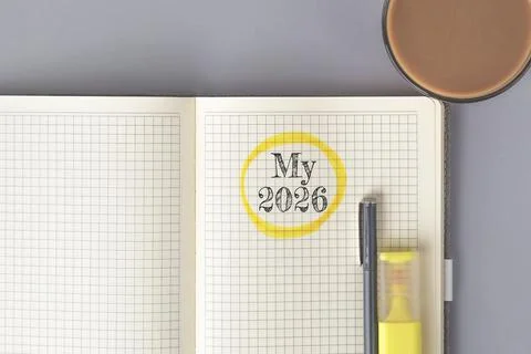 Open notebook with squared pages and the handwritten text My 2026 circled in  Stock Photos