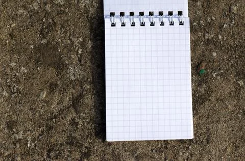 Open notebook on stone background Foto stock