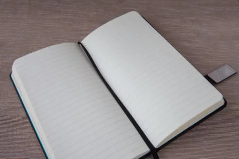 Open notebook on the table Stock Photos