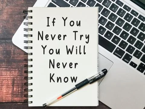 Open notebook with text "If You Never Try You Will Never Know" 스톡 사진