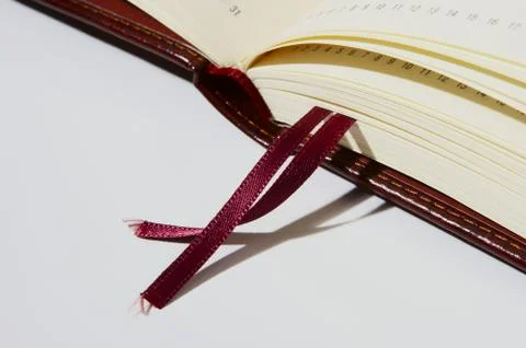 Open notebook on white Photos