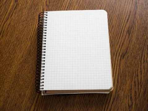 Open notebook on a wooden table Stock Photos