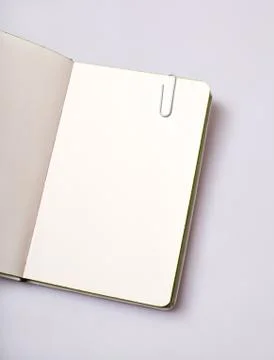 Open notepad blank page on white table Foto stock