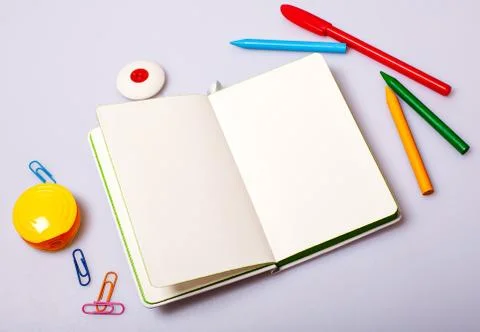 Open notepad with blank pages on table with office tools Stock Photos