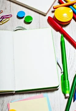 Open notepad with blank pages on table with office tools Stock Photos