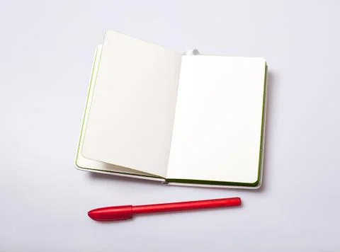 Open notepad with blank pages on white table Stock Photos