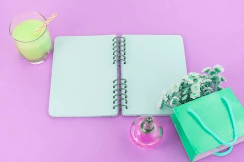 Open Notepad clean pages to write a bouquet of flowers in a paper bag glass c Stock Photos