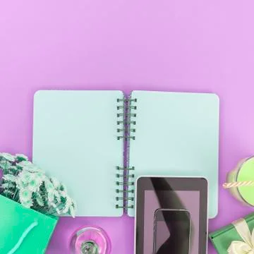 Open Notepad clean pages for writing a bouquet of flowers in a paper bag glas Stock Photos