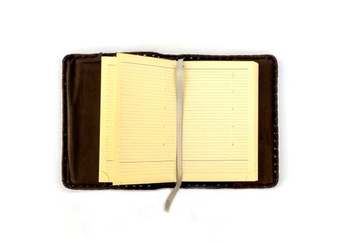 Open Notepad in dark brown genuine leather covers on a white background. Stock Photos