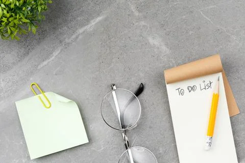 Open notepad on marble background. Stock Photos