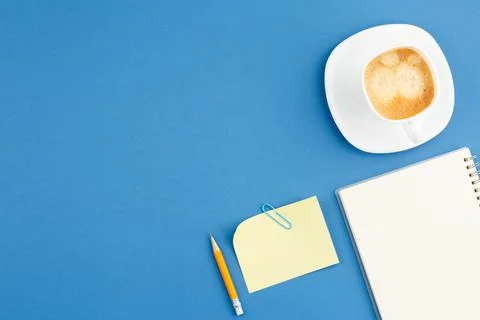 Open notepad with pencil, cup of coffee note sheet Stock Photos