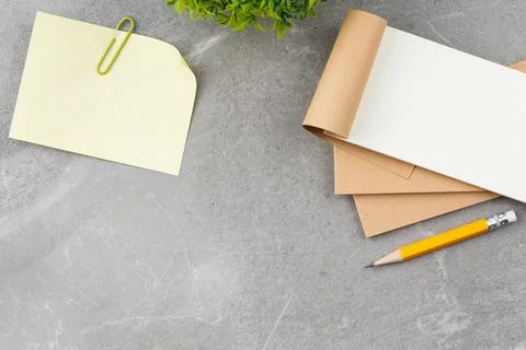 Open notepad with pencil, office work desk. Stock Photos