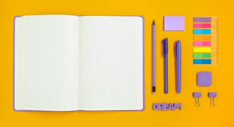 Open notepad with space for your text with colorful school and office supplie Stock Photos