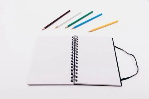 Open notepad with spring with two blank sheets Stock Photos