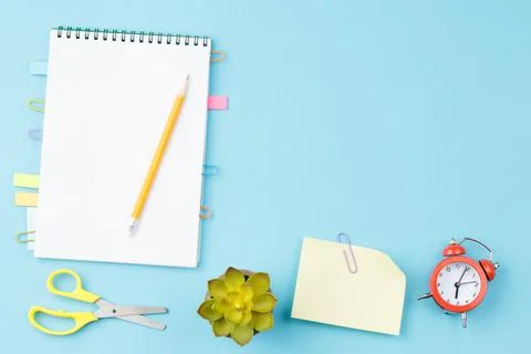 Open notepad with stationery. Flat lay Stock Photos