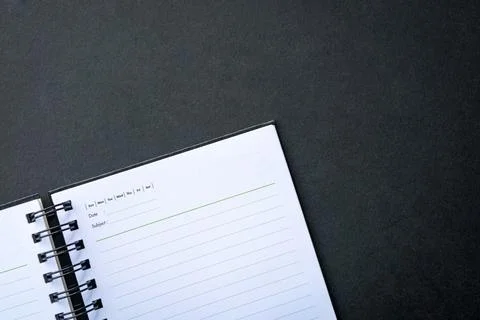Open notepad on top of dark background Stock Photos