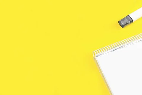 Open notepad on trendy yellow background Stock Photos