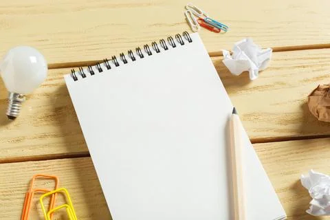 Open notepad on wooden background Stock Photos
