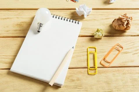 Open notepad on wooden background Stock Photos