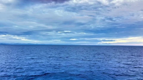 Open Ocean Under Dramatic Cloudy Sky During Maritime Journey Stock Footage 335921116