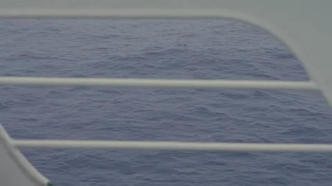 Open Ocean Viewed Through Ship Deck Railing with Fast Moving Choppy Waves Stock Footage 332131444