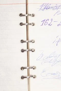 Open old notepad with written numbers. 스톡 사진