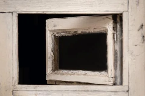 Open old retro window white color, close up. Stock Photos