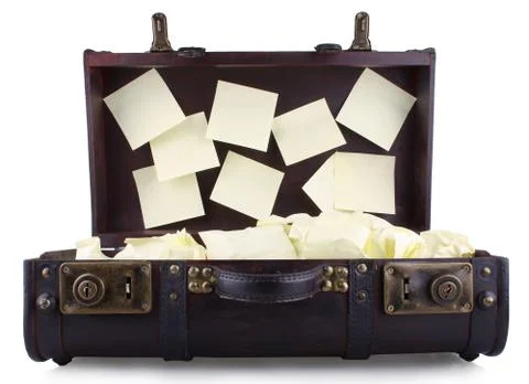 Open old suitcase with yellow notepad Stock Photos