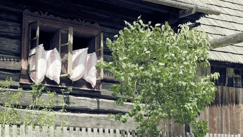Open old window with pillows. Airing out of sleeping blankets Stock Footage 98039414