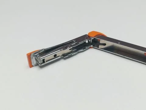 Open Orange Metallic Desktop Stapler on White Background Stock Photos
