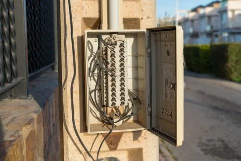 Open outdoor electrical distribution box with wiring Stock Photos