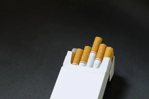 An open pack of cigarettes Stock Photos