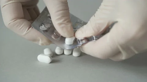 Open the pack of medicines. Stock Footage 154690421