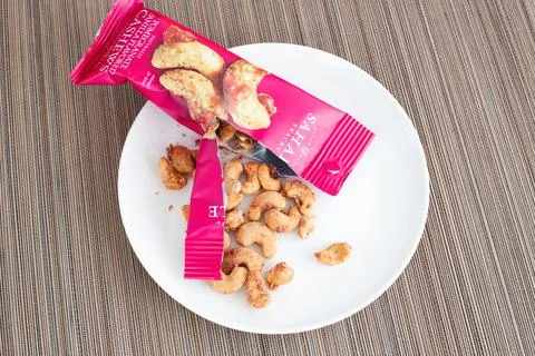 An open pack of Sahale Snacks, Glazed Mix, Pomegranate Vanilla Flavored Cashe Stock Photos