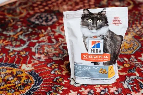 Open package with Hills Science Plan Veteranarian Sterilised Cat dry pet food on Photos