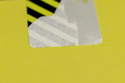 An open package with a torn protective sticker against opening and theft, a t Stock Photos