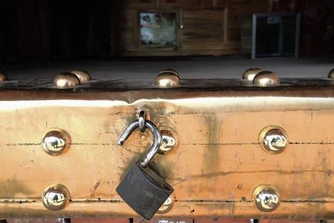 Open padlock-brass sheet threshold-cave temple door. MatiSi-Horse Hoof Temple-CN Stock Photos