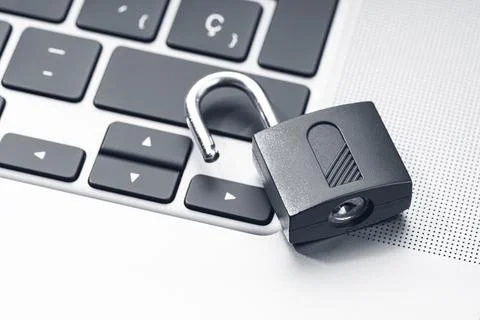 Open padlock on modern laptop. Computer Security Vulnerability concept Stock Photos