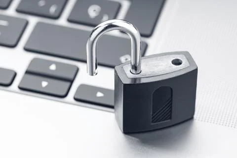 Open padlock on modern laptop. Computer Security Vulnerability concept Stock Photos
