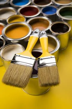 Open paint cans with a brush, Rainbow colors Stock Photos
