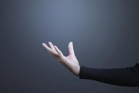 Open palm hand gesture presenting invisible hologram Stock Photos